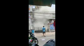 Moment three-storey building in Jakarta collapses seconds after workers escape
