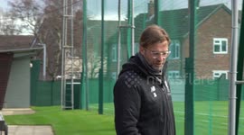 Slow motion shot of Liverpool Manager Jurgen Klopp as he heads out to a pre match training session