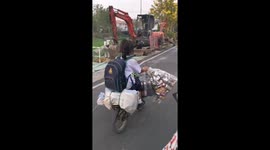 Schoolgirl Rides Home With Trash To Recycle