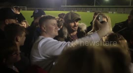 David Beckham swamped by fans while watching son's football game in UK