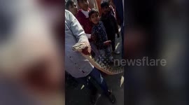 Locals take snake selfies with 10-foot-long python lying on road in northern India