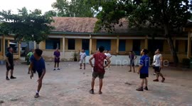 Group of Vietnamese men casually hit EPIC backheel volleys with shuttlecock