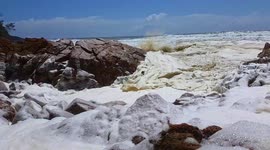 Australian beach with 'unusually high tide' and sea foam closed ahead of Cyclone Uesi