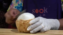 Chef shows how to remove coconut meat and water in one piece