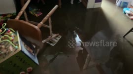 Items inside home left floating in muddy water in Welsh village during Storm Dennis