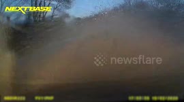 Derbyshire flooding causes dangerous driving conditions as car windscreen splashed with water