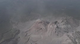 approching to volcano Santiaguito when lets out small clouds of ash