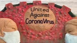 Sand artist appeals for unity over coronavirus outbreak with giant sculpture on beach in East India