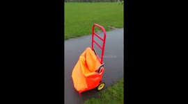 Storm Dennis 'helps out' paperboy by pushing trolley down the road