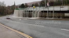 Storm Dennis causes UK car park to overflow resembling a waterfall
