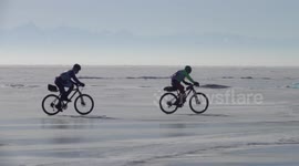 Brave athletes take part in 210km endurance race across frozen lake in Russia