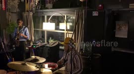 Jazz two-piece band jam to the sound of fire alarm in London venue