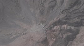 volcano Santiaguito lets out a plume of small ash