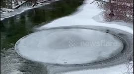 Bizarre phenomenon sees circular ice sheet spinning in Michigan river