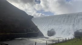 Dam overflows after storm Dennis with amazing waterfall