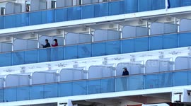 Passengers seen on Diamond Princess cruise ship ahead of authorised disembarkation