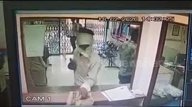 Hilarious moment amateur bank robber loses nerve and flees