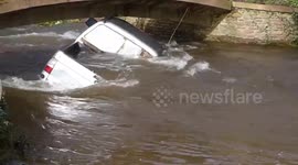 Bridge cordoned off after car gets lodged underneath in Storm Dennis floods