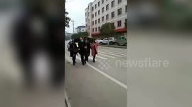 Chinese citizens punished for playing mahjong by being forced to carry table to police station amid coronavirus lockdown