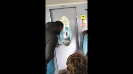 Passengers watch from neighbouring carriage as police tase man carrying knife at Queens Road Peckham station