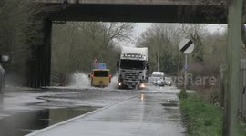 UK drivers ignore 'road closed' sign and drive through flooded road