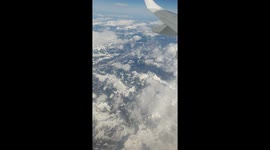 Far above the clouds covering the majestic Alps