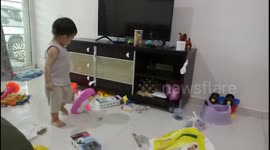 Messy toddler makes the house in a mess