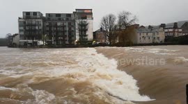 Localised flooding causes river to swell in Cumbria, UK