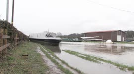 Canal boat left stranded on path after Storm Dennis flooding in Derbyshire