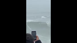Surfer has narrow escape during World Surf League Tow Surfing Challenge at Nazaré, Portugal