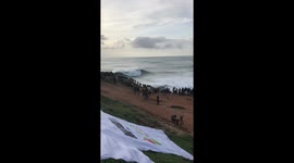 Surfers make the most of the giant waves at Nazaré, Portugal during World Surf League Tow Surf Challenge