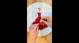 Sweet! Talented food stylist blows up on TikTok creating Jennifer Lawrence dress using a POMEGRANATE