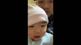 A 8-month-old girl is practicing saying