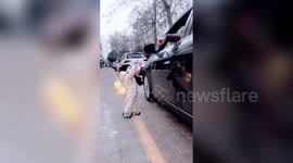 One-year-old shames Chinese motorist by returning plastic bottle that he threw out of his car