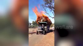Loaded tractor crashes off-road in flames after sparking from powerline in north India