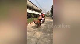 Young Liverpool supporters have 'open top bus parade' in wheelbarrows and carts