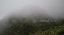 Mount Pelée volcano covered in clouds