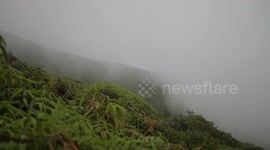 Mount Pele volcano covered in clouds on Martinique island