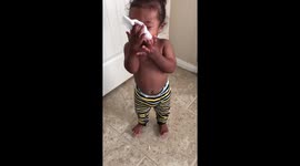 Toddler Imitates Blowing Nose