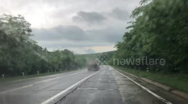 Truck forced to make dangerous turns during heavy rain. Europe's worst roads.