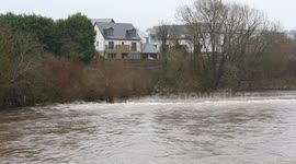 UK's winter of floods continues as River Lune in Lancashire bursts its banks
