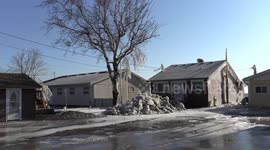 Rare footage of houses encased in ice after freezing spray rain and wind storm hits the town of Erieu on the Lake Erie shore in Ontario Canada