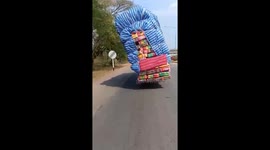 Overloaded Truck Sways Dangerously To The Side