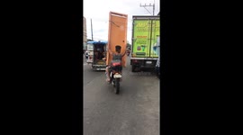 Motorcycle Passenger Carries Wooden Door