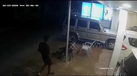 Cheeky thief sneaks up on sleeping security guard and snatches his phone from his pocket