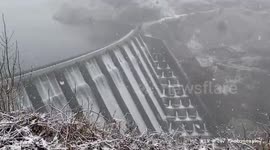 Clywedog Reservoir Mid-Wales, overflowing and snowing.