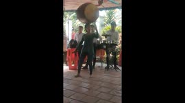 Vietnamese woman able to play barrel-sized drum that's balanced on her head
