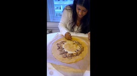 World record-holding henna artist decorates crepe with Nutella design for Shrove Tuesday