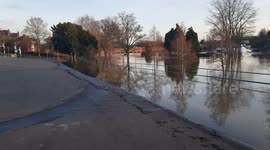 River Severn breaks its banks in the UK flooding children's playground and huge car park