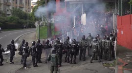 Colombia riot police use water cannon and stun grenades on protesting students